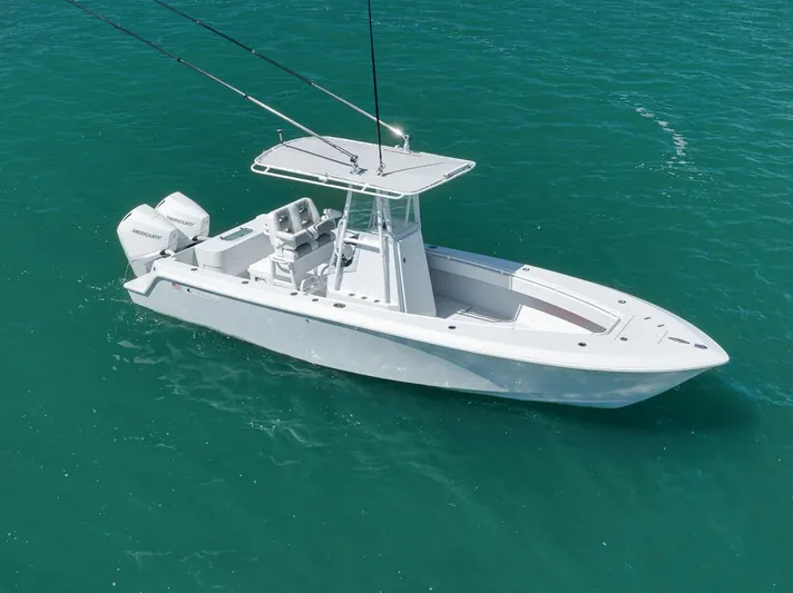  Yacht Photos Pics 2004 Contender 25 Tournament boat on clear turquoise water, equipped with dual outboard motors.