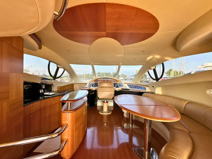 Andiamo Yacht Photos Pics Luxurious interior of a 2010 Azimut 55E yacht with elegant wood finishes.