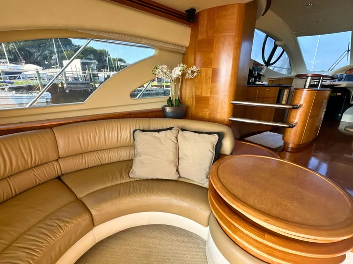 Andiamo Yacht Photos Pics Luxurious interior of 2010 Azimut 55E yacht with leather seating and wooden accents.