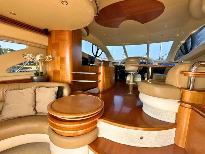 Andiamo Yacht Photos Pics Luxurious interior of a 2010 Azimut 55E yacht with elegant wood and leather finishes.