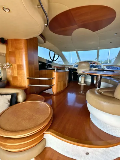 Andiamo Yacht Photos Pics Luxurious interior of a 2010 Azimut 55E yacht with elegant wood finishes and modern design.