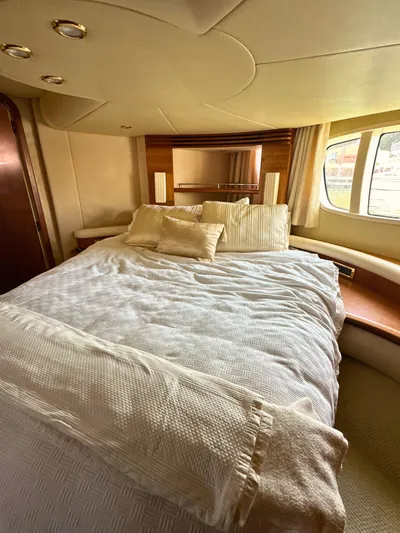 Andiamo Yacht Photos Pics Luxurious bedroom interior of 2010 Azimut 55E yacht with elegant bedding and window view.