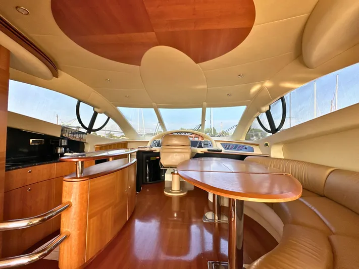 Andiamo Yacht Photos Pics Luxurious interior of a 2010 Azimut 55E yacht with elegant wood finishes.