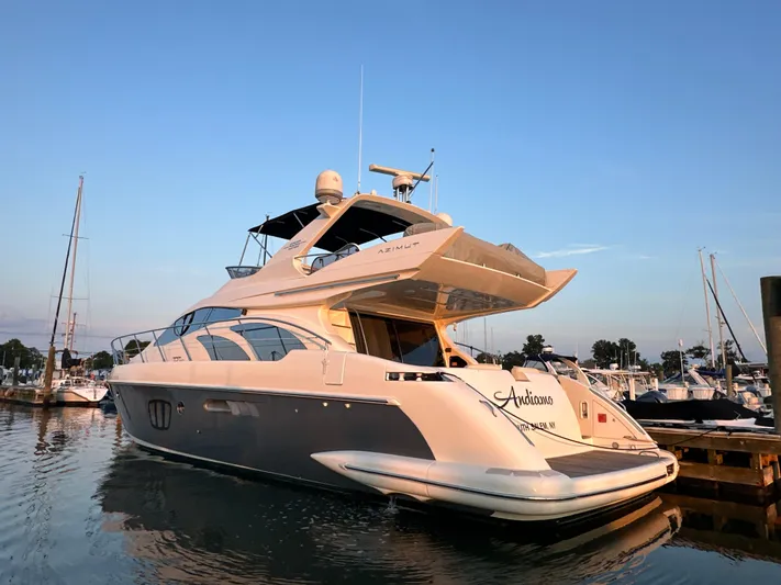 Andiamo Yacht Photos Pics Luxury 2010 Azimut 55E yacht docked at marina during sunset.