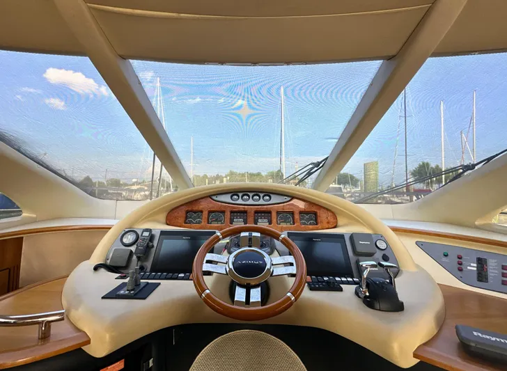 Andiamo Yacht Photos Pics Cockpit view of a 2010 Azimut 55E yacht with modern navigation controls.