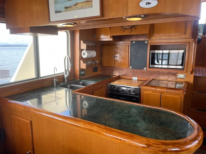Sojourner Yacht Photos Pics Luxurious kitchen interior of 2002 Transpacific Marine EAGLE 53 yacht with modern amenities.