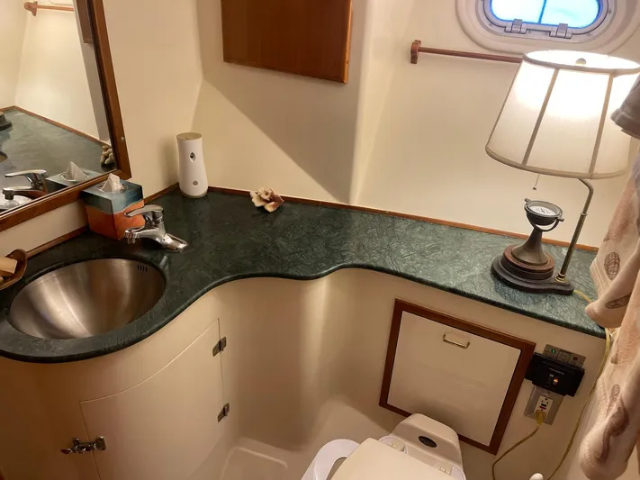 Sojourner Yacht Photos Pics Bathroom interior of 2002 Transpacific Marine EAGLE 53 yacht with sink and lamp.