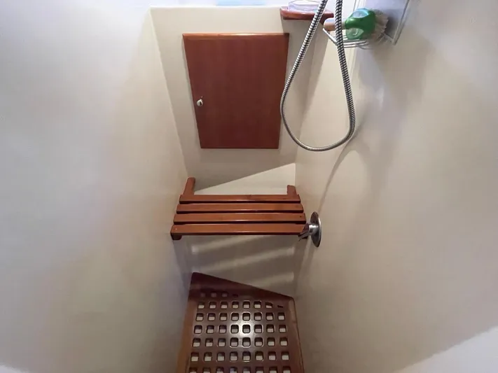 Sojourner Yacht Photos Pics Shower area in 2002 Transpacific Marine EAGLE 53 yacht with wooden seat and floor.
