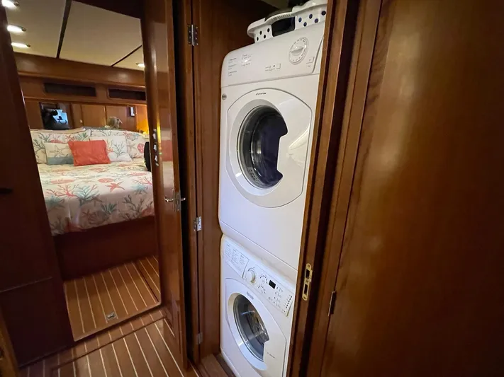 Sojourner Yacht Photos Pics Laundry area on 2002 Transpacific Marine EAGLE 53 yacht, with stacked washer and dryer.
