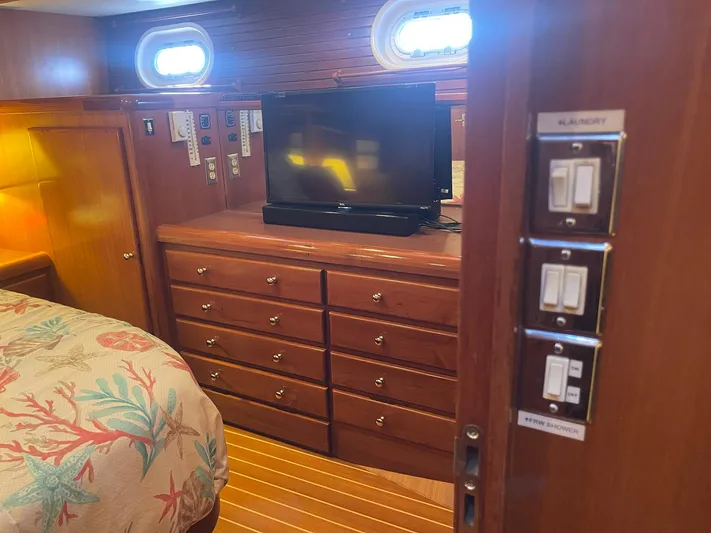 Sojourner Yacht Photos Pics Luxurious cabin interior of 2002 Transpacific Marine EAGLE 53 yacht with TV and dresser.