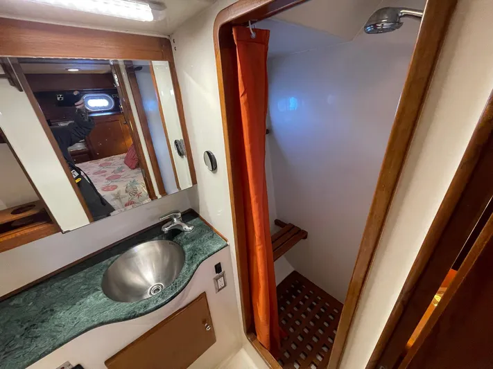 Sojourner Yacht Photos Pics Bathroom interior of 2002 Transpacific Marine EAGLE 53 yacht, featuring sink and shower.