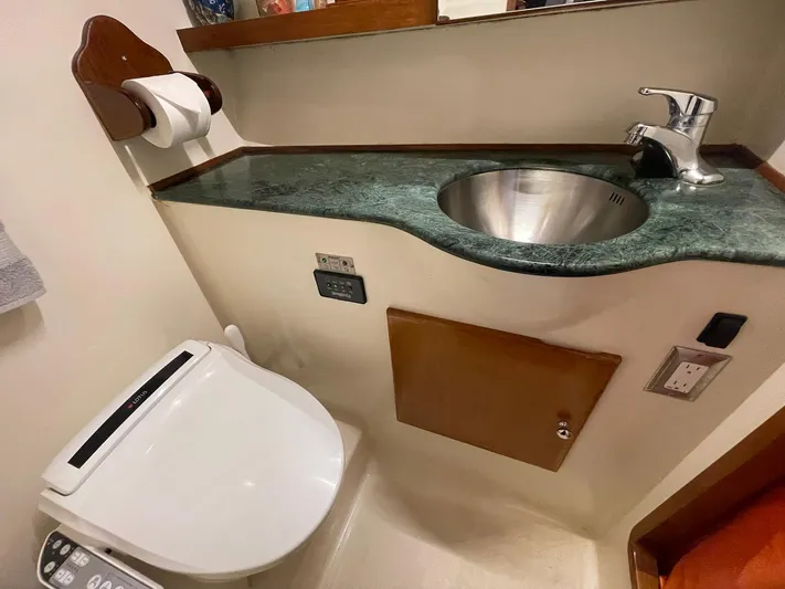 Sojourner Yacht Photos Pics Bathroom interior of 2002 Transpacific Marine EAGLE 53 yacht with sink and toilet.