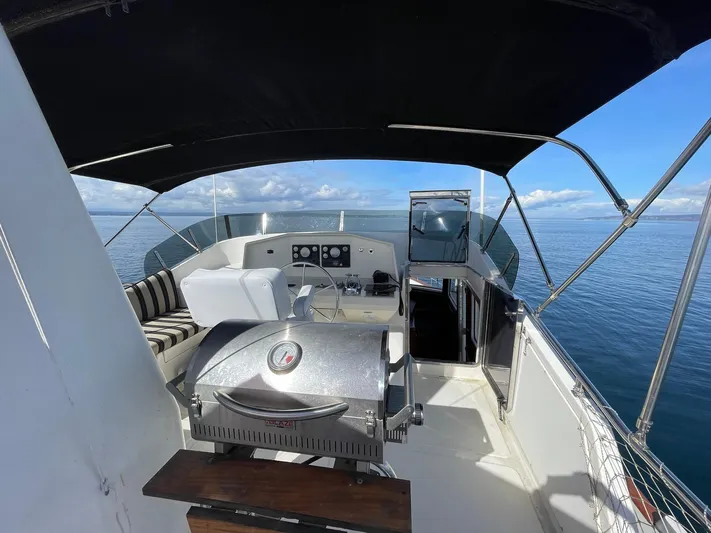 Sojourner Yacht Photos Pics Flybridge of 2002 Transpacific Marine EAGLE 53 yacht with grill and seating, ocean view.