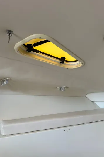 Yacht Photos Pics 2005 Hydra-Sports 33VX cabin interior with ceiling hatch and lighting fixtures.