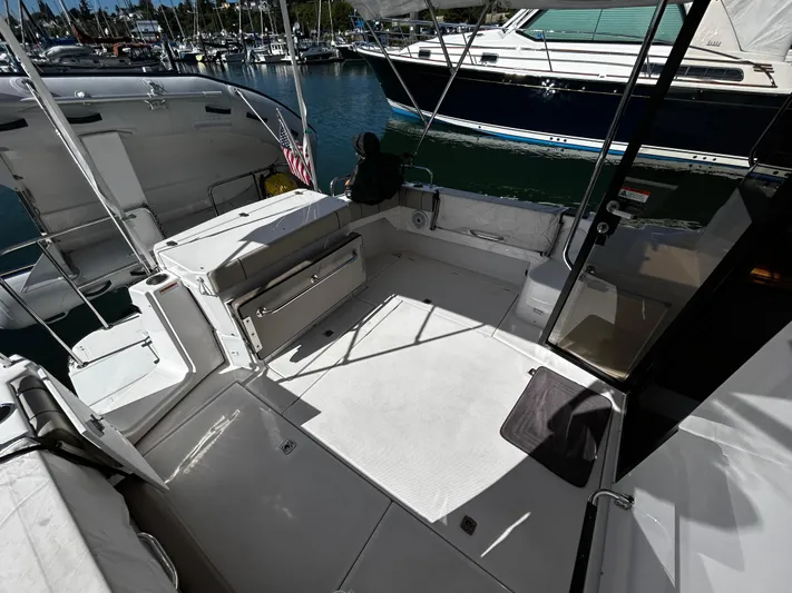 Blue Gail Yacht Photos Pics 2020 Cutwater C-30 Sedan boat interior, featuring spacious deck and seating area in marina setting.