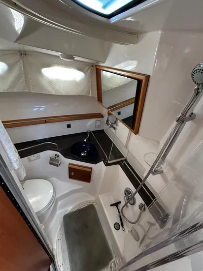 Blue Gail Yacht Photos Pics 2020 Cutwater C-30 Sedan bathroom with shower, sink, and toilet.