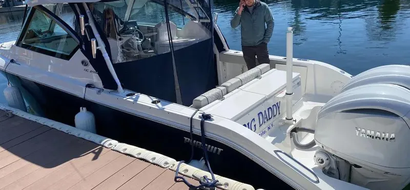  Yacht Photos Pics 2022 Pursuit DC 295 Dual Console boat docked with Yamaha engines.