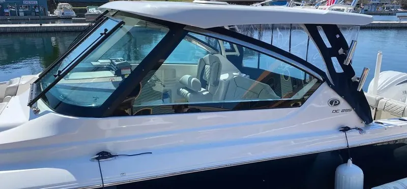  Yacht Photos Pics 2022 Pursuit DC 295 Dual Console boat docked at a marina.