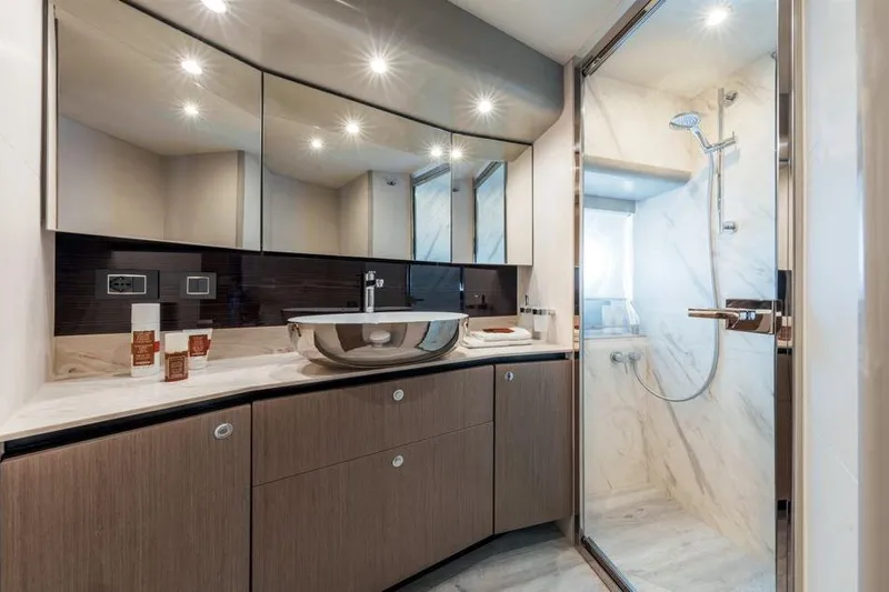  Yacht Photos Pics Luxurious bathroom in 2026 Absolute NAVETTA 50 yacht with modern fixtures and elegant design.