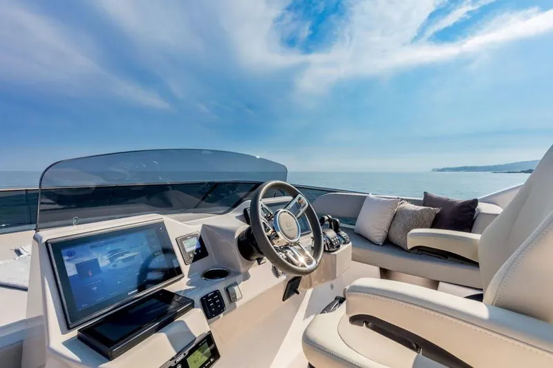  Yacht Photos Pics Luxurious helm of 2026 Absolute NAVETTA 50 yacht with modern controls and ocean view.