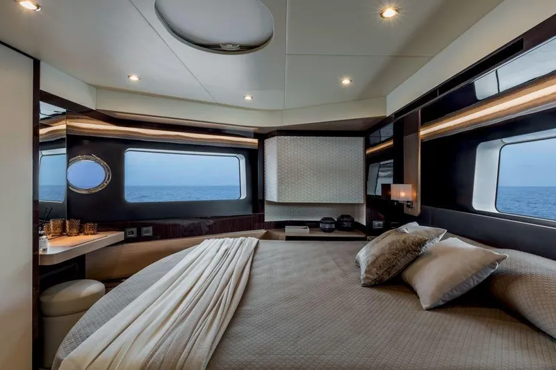  Yacht Photos Pics Luxurious bedroom interior of 2026 Absolute NAVETTA 50 yacht with ocean view windows.