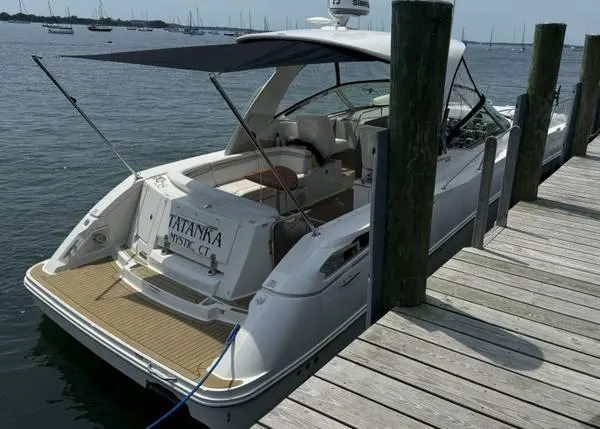  Yacht Photos Pics Sea Ray 370 Sundancer 2010 docked at a marina with canopy and open deck.
