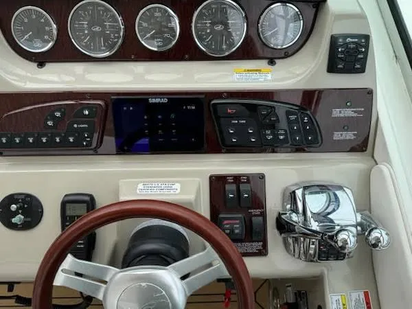  Yacht Photos Pics Dashboard of 2010 Sea Ray 370 Sundancer with gauges, controls, and steering wheel.