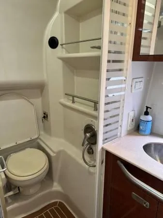  Yacht Photos Pics 2010 Sea Ray 370 Sundancer bathroom with toilet, sink, and shower area.