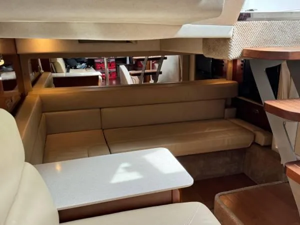  Yacht Photos Pics Interior of 2010 Sea Ray 370 Sundancer yacht with beige seating and wooden accents.