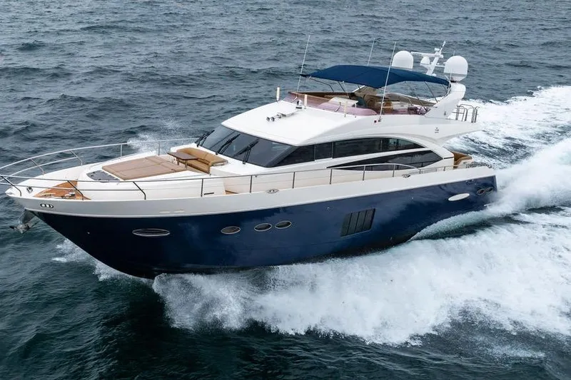  Yacht Photos Pics 2012 Princess Flybridge 72 Motor Yacht cruising on open water.