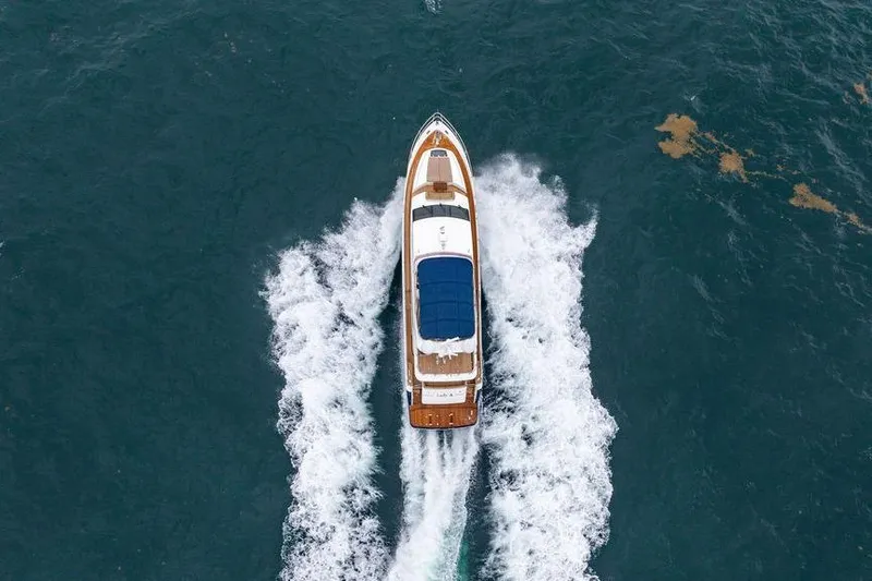  Yacht Photos Pics Aerial view of 2012 Princess Flybridge 72 Motor Yacht cruising on open water.