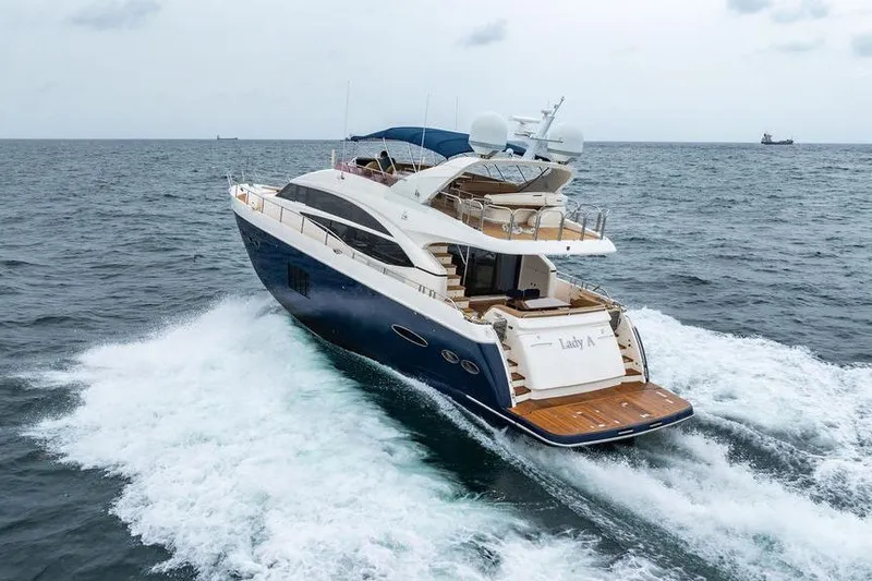  Yacht Photos Pics 2012 Princess Flybridge 72 Motor Yacht cruising on open sea.