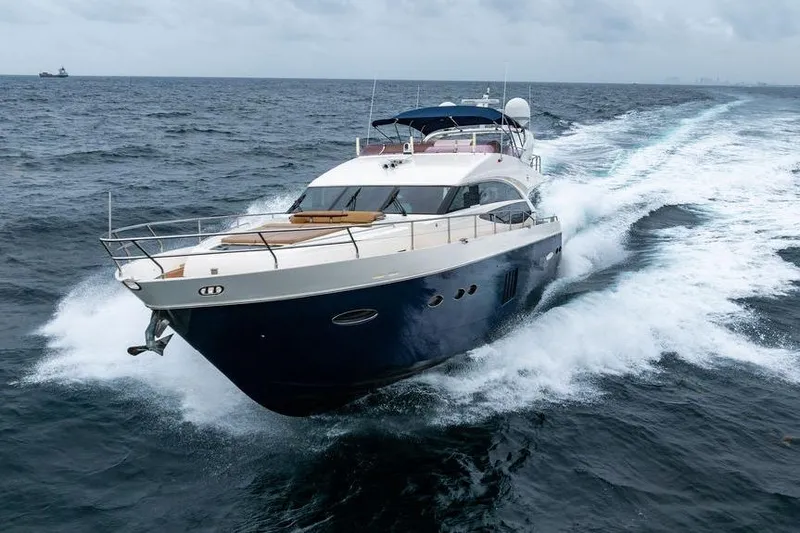  Yacht Photos Pics 2012 Princess Flybridge 72 Motor Yacht cruising on open sea.