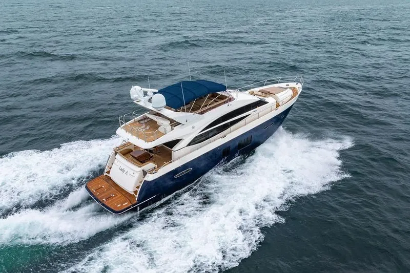  Yacht Photos Pics 2012 Princess Flybridge 72 Motor Yacht cruising on open water.