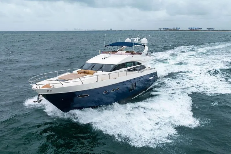  Yacht Photos Pics 2012 Princess Flybridge 72 Motor Yacht cruising on open water.