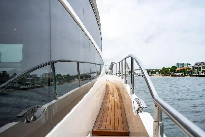  Yacht Photos Pics Side view of 2012 Princess Flybridge 72 Motor Yacht on water.