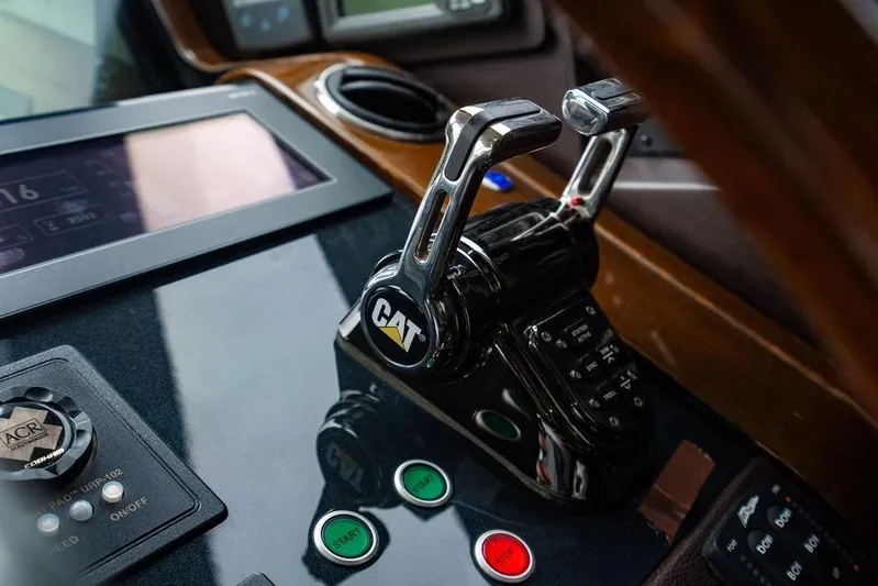  Yacht Photos Pics Control panel of 2012 Princess Flybridge 72 Motor Yacht with CAT throttle levers.