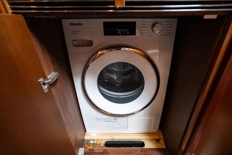  Yacht Photos Pics Miele washing machine in 2012 Princess Flybridge 72 Motor Yacht laundry area.
