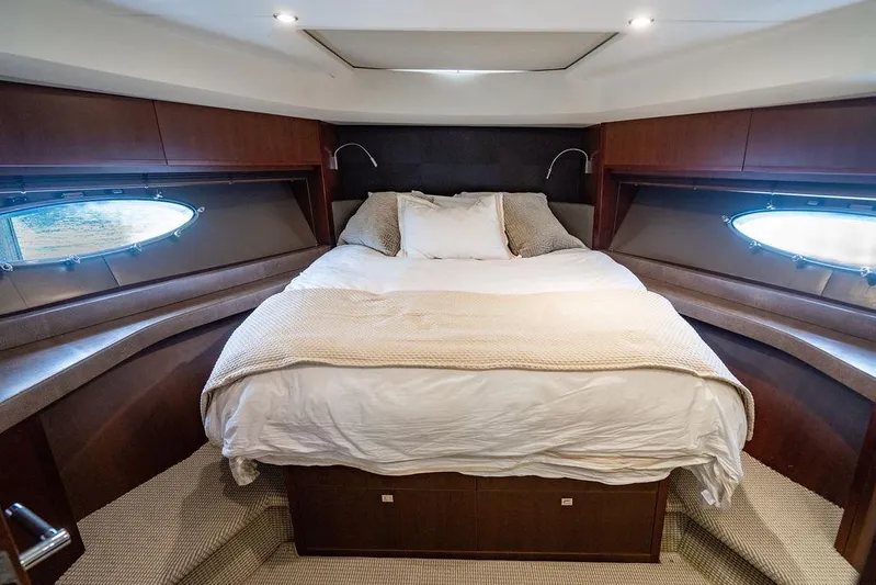  Yacht Photos Pics Luxurious bedroom interior of 2012 Princess Flybridge 72 Motor Yacht with cozy bedding.