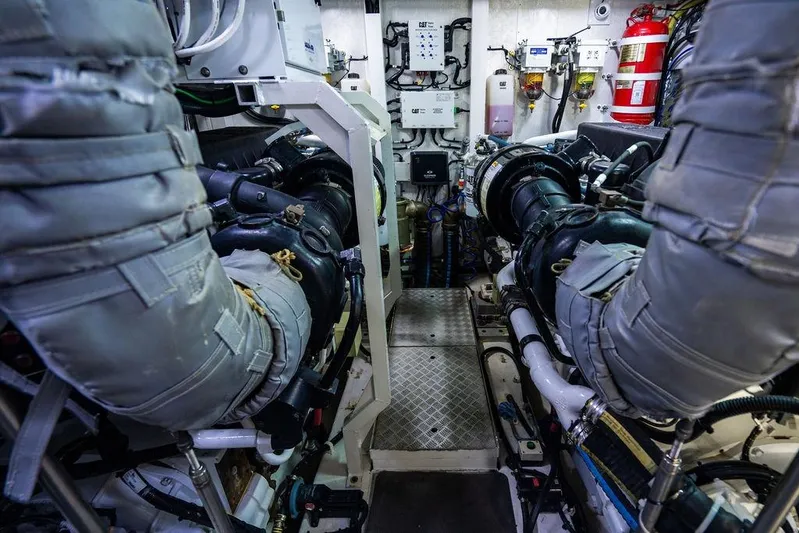  Yacht Photos Pics Engine room of 2012 Princess Flybridge 72 Motor Yacht, showcasing complex machinery and equipment.