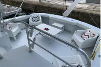 Luxurious 2004 Hatteras 70 Enclosed Bridge yacht with stylish seating and modern design.