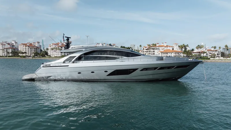 Alexandra Yacht Photos Pics 2020 Pershing 8X luxury yacht on calm water with scenic coastal backdrop.