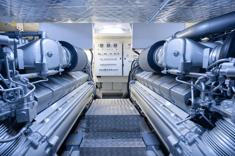 Alexandra Yacht Photos Pics Engine room of a 2020 Pershing 8X yacht, featuring advanced machinery and control panels.