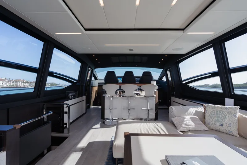 Alexandra Yacht Photos Pics Luxurious interior of 2020 Pershing 8X yacht with modern seating and panoramic windows.