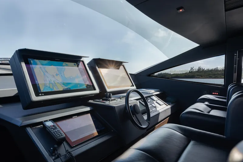 Alexandra Yacht Photos Pics Cockpit of 2020 Pershing 8X yacht with modern navigation screens and sleek design.