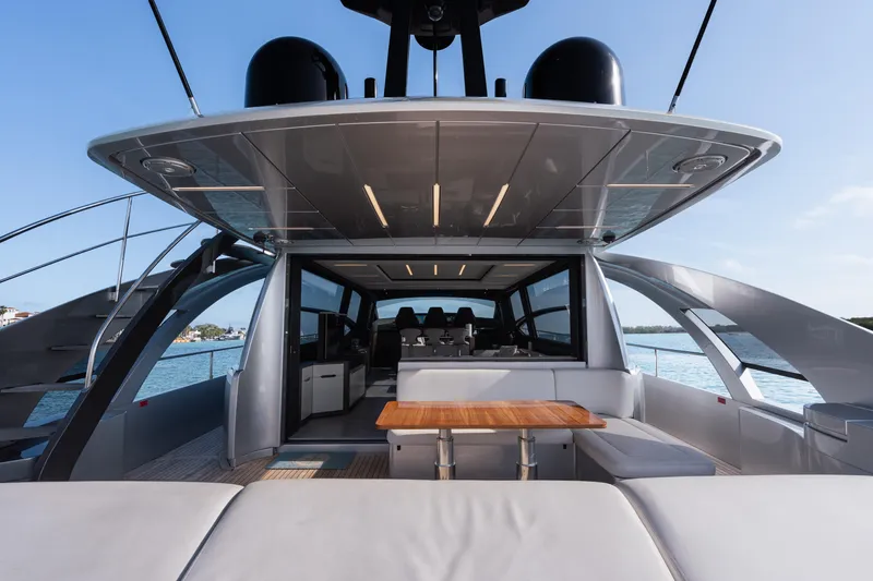 Alexandra Yacht Photos Pics Luxury Pershing 8X yacht interior, 2020 model, featuring sleek design and spacious seating area.