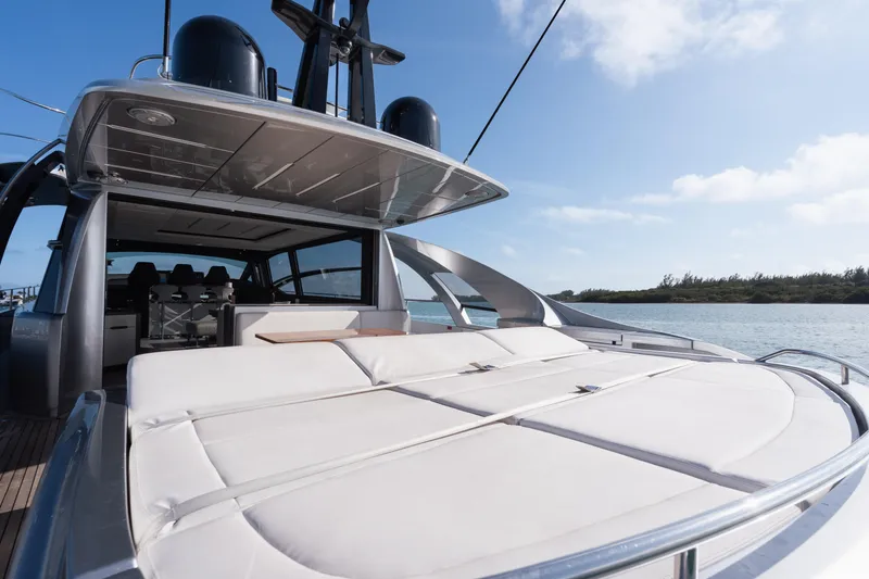 Alexandra Yacht Photos Pics 2020 Pershing 8X luxury yacht with spacious sun deck, cruising on a sunny day.