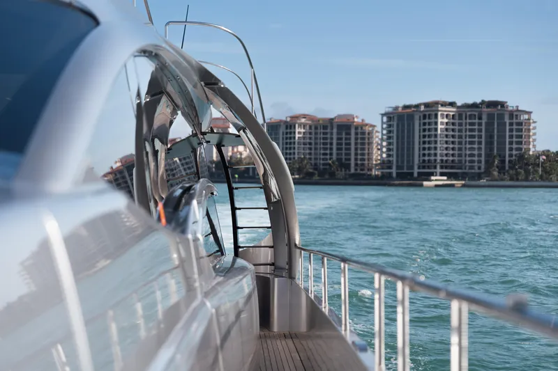 Alexandra Yacht Photos Pics Luxury Pershing 8X yacht cruising near waterfront buildings, 2020 model.