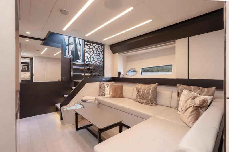Alexandra Yacht Photos Pics Luxurious interior of 2020 Pershing 8X yacht with modern seating and elegant decor.