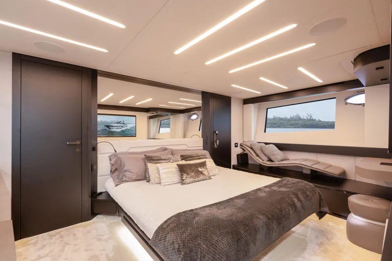 Alexandra Yacht Photos Pics Luxurious interior of 2020 Pershing 8X yacht with modern bedroom design and large windows.